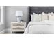 Close up of a luxury main bedroom boasts a nightstand and decor at 2528 Magnolia Ridge Dr, Marietta, GA 30067