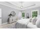 A luxurious main bedroom boasts natural lighting, tasteful furniture and decor at 2528 Magnolia Ridge Dr, Marietta, GA 30067