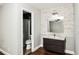 Modern bathroom featuring decorative stone wall, new vanity, sink, and tiled walk-in shower at 6331 Wedgeview Dr, Tucker, GA 30084