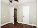 Bedroom with hardwood floors, white trim, and white doors to other rooms at 6331 Wedgeview Dr, Tucker, GA 30084