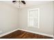 Cozy bedroom with hardwood flooring, a ceiling fan, and a bright window at 6331 Wedgeview Dr, Tucker, GA 30084