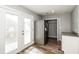 Charming kitchen area with stainless steel appliances, white cabinets and access to an outdoor deck at 6331 Wedgeview Dr, Tucker, GA 30084