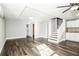 Open concept space with hardwood flooring, a staircase, and a fully equipped kitchenette at 6331 Wedgeview Dr, Tucker, GA 30084