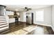 Inviting living space with hardwood floors flowing into a modern kitchen with stainless steel appliances at 6331 Wedgeview Dr, Tucker, GA 30084