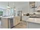 Modern kitchen with stainless steel appliances, marble countertops, and island at 190 Rolison Way, Fayetteville, GA 30214