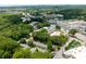 Wide aerial view of a community nestled among mature trees and near city amenities at 2232 Dunseath Ave # 407, Atlanta, GA 30318