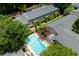 Aerial view of a community pool, building exteriors, and manicured landscaping at 2232 Dunseath Ave # 407, Atlanta, GA 30318