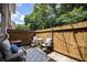 Outdoor patio featuring a privacy fence, outdoor furniture and string lights at 2232 Dunseath Ave # 407, Atlanta, GA 30318