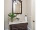Bathroom featuring dark wood vanity with marble countertop and stylish mirror at 854 Club Moss Ct, Marietta, GA 30068