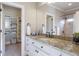 Elegant bathroom featuring a large vanity with granite counters and walk in closet at 854 Club Moss Ct, Marietta, GA 30068