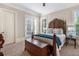 Bedroom with french doors leading to the outside and stylish furniture at 854 Club Moss Ct, Marietta, GA 30068