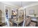 Elegant dining room with a crystal chandelier and seating for eight guests at 854 Club Moss Ct, Marietta, GA 30068
