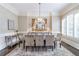 Formal dining room with elegant chandelier, large window, and seating for eight at 854 Club Moss Ct, Marietta, GA 30068