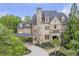 Stunning stone and brick home with a porte-cochere and professionally landscaped front yard at 854 Club Moss Ct, Marietta, GA 30068