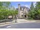 Charming stone and brick home with porte-cochere on a tree-lined street at 854 Club Moss Ct, Marietta, GA 30068