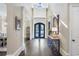 Welcoming foyer with hardwood floors, a stylish console table, and an artful view at 854 Club Moss Ct, Marietta, GA 30068