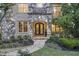 Beautiful stone entryway with custom iron doors and manicured landscaping at 854 Club Moss Ct, Marietta, GA 30068