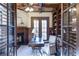 Home office featuring a fireplace, built-in bookshelves, and french doors at 854 Club Moss Ct, Marietta, GA 30068