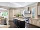 Well-appointed kitchen with granite countertops, island with seating, stainless steel appliances, and custom cabinetry at 854 Club Moss Ct, Marietta, GA 30068