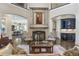 Cozy living room with fireplace, grand staircase and built-in wet bar, perfect for entertaining guests at 854 Club Moss Ct, Marietta, GA 30068