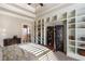 Elegant main bedroom with tray ceilings, built in shelving, and decorative screen at 854 Club Moss Ct, Marietta, GA 30068