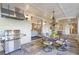 Outdoor dining area has a grill, chandelier, and a view of the home's interior at 854 Club Moss Ct, Marietta, GA 30068