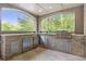 Outdoor kitchen with stone facade, stainless steel grill, and built-in appliances at 854 Club Moss Ct, Marietta, GA 30068