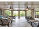 Covered outdoor living space with ceiling fans and comfortable seating area at 854 Club Moss Ct, Marietta, GA 30068