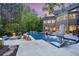 A luxury home's outdoor area featuring a large pool, covered patio and outdoor seating at 854 Club Moss Ct, Marietta, GA 30068