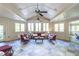 Bright sunroom features multiple windows, tile floor, and a cozy seating arrangement at 854 Club Moss Ct, Marietta, GA 30068