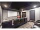 Home theater features tiered seating, a large screen, and moody lighting at 854 Club Moss Ct, Marietta, GA 30068