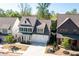 Aerial view of charming two-story home with manicured lawn at 920 Wemberley Ln, Marietta, GA 30064