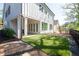 Exterior view of a white farmhouse with manicured lawn at 920 Wemberley Ln, Marietta, GA 30064
