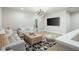 Cozy bonus room with comfortable seating, modern lighting, and a large-screen television at 920 Wemberley Ln, Marietta, GA 30064