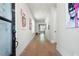 Elegant hallway featuring hardwood floors, stylish artwork, and abundant natural light at 920 Wemberley Ln, Marietta, GA 30064