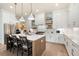 Bright kitchen features stainless steel appliances, modern white cabinets, and a large island with barstool seating at 920 Wemberley Ln, Marietta, GA 30064