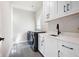 Laundry room featuring modern appliances, countertops, and storage space at 920 Wemberley Ln, Marietta, GA 30064