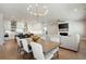 Bright and airy living space with modern lighting and seamless flow to the kitchen and dining area at 920 Wemberley Ln, Marietta, GA 30064
