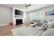Spacious living room featuring a fireplace, large television, lots of natural light and a comfortable couch at 920 Wemberley Ln, Marietta, GA 30064
