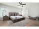 Serene main bedroom with hardwood floors, a comfortable bed, and ample natural light at 920 Wemberley Ln, Marietta, GA 30064