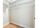 Empty walk-in closet with built-in shelving and wooden floors at 920 Wemberley Ln, Marietta, GA 30064