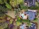 Expansive backyard featuring a sparkling pool, lush landscaping, manicured lawn, and mature trees at 1319 Glen Cedars Dr, Smyrna, GA 30126