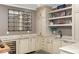 Basement bar area with marble countertops, custom cabinets, and wine fridge at 1319 Glen Cedars Dr, Smyrna, GA 30126