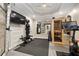 Finished basement gym with modern workout equipment, bright lighting, and a sauna for relaxation after workouts at 1319 Glen Cedars Dr, Smyrna, GA 30126