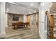 Finished basement featuring a stone accent wall, staircase and ping pong table at 1319 Glen Cedars Dr, Smyrna, GA 30126