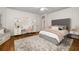Bright bedroom featuring a large bed, a plush rug, a built-in desk and stylish decor at 1319 Glen Cedars Dr, Smyrna, GA 30126
