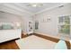 Light-filled bedroom with a white bed frame, soft rug, and natural light at 1319 Glen Cedars Dr, Smyrna, GA 30126