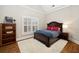 Inviting bedroom with hardwood floors, a comfortable bed, and natural light at 1319 Glen Cedars Dr, Smyrna, GA 30126