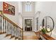 Grand foyer with hardwood floors, high ceilings, and a staircase with wood railing at 1319 Glen Cedars Dr, Smyrna, GA 30126