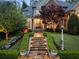 Charming two-story home with stone walkway, manicured lawn, and lush landscaping at 1319 Glen Cedars Dr, Smyrna, GA 30126